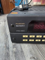 Musicom Pro 660 Karaoke, Pro 565 Microphone, TMX 7. Powers On. Untested.