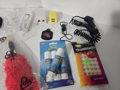 Mixed Lot Of Office Supplies, Chargers, Ear Buds, Exc. Check Photos