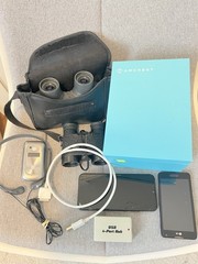 Lot Of 9 Electronics Security Camera Binoculars Smartphones Headphones USB Cable